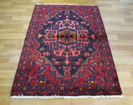 Traditional Borujerd rug from Iran, featuring geometric patterns and a rich, durable wool pile
