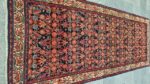 Handwoven Saveh runner with geometric patterns and natural earthy tones from Saveh City, Iran